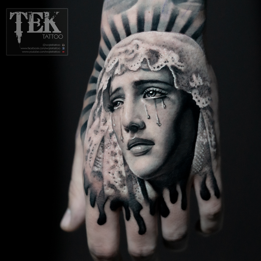 Virgin Mary hand tattoo
