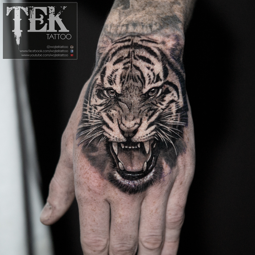 Tiger hand tattoo